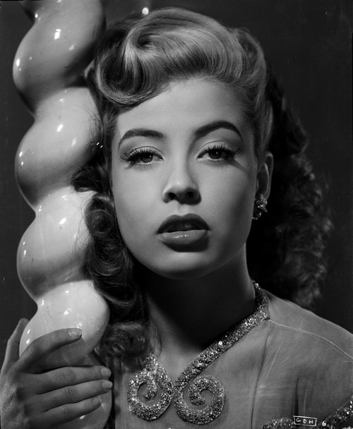 Gloria DeHaven in A Portrait Leaning On A Pole in Black and White Photo Print - Item # VARCEL697464