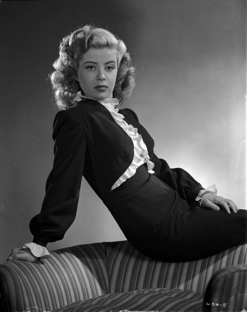 Gloria DeHaven posed On A Chair in Black Formal Dress in Black and White Photo Print - Item # VARCEL697535