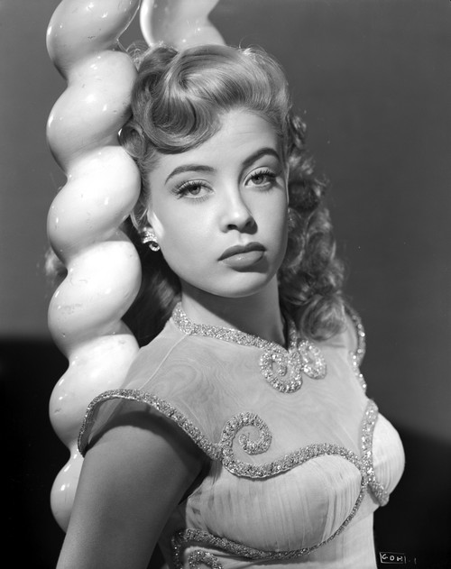 Gloria DeHaven Leaning On A Pole in Fancy Dress in Black and White Photo Print - Item # VARCEL697538