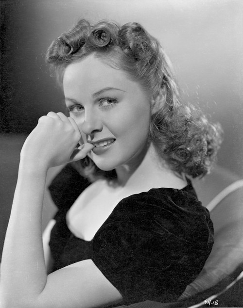 Susan Hayward sitting and Leaning on a Black Dress Photo Print - Item # VARCEL697659