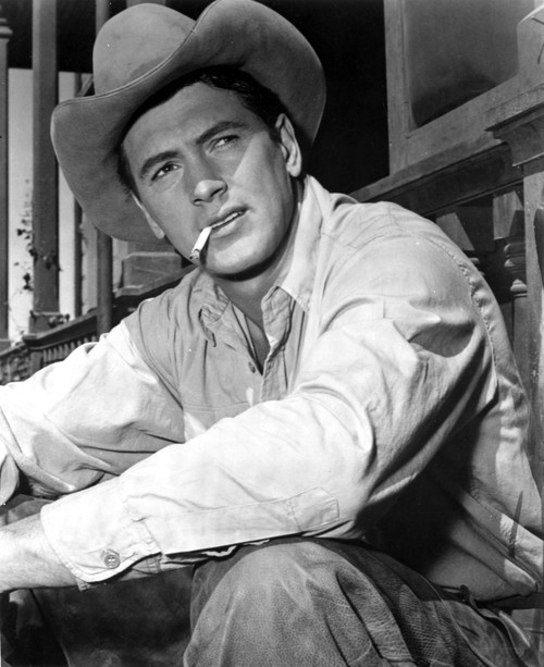 Rock Hudson Posed in Cowboy Outfit With Cigarette in Mouth Photo Print - Item # VARCEL697655