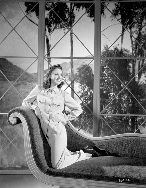 Susan Hayward Kneeling on a Couch in Long Sleeve Blouse Photo Print - Item # VARCEL697680