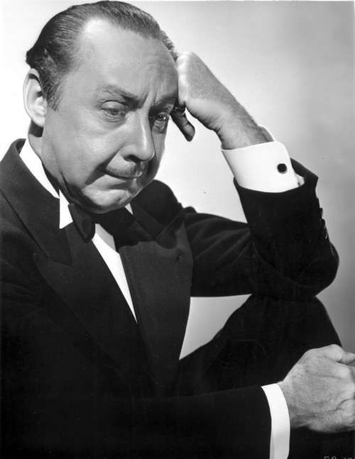 Franklin Pangborn Posed in Black Suit With Head Leaning on Hand Photo Print - Item # VARCEL697682