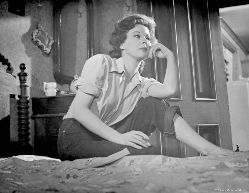Susan Hayward Posed in a Black Jeans on Bed Photo Print - Item # VARCEL697674