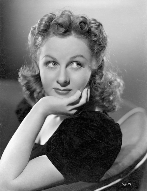 Susan Hayward sitting and Face Leaning on Hand on Chair in Black Dress Photo Print - Item # VARCEL697720