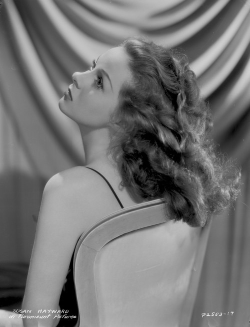 Susan Hayward sitting on a Chair with Curly Hair Photo Print - Item # VARCEL697747