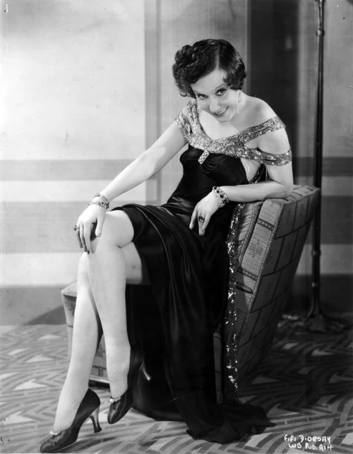 Fifi Dorsay Seated on Chair in Dress Photo Print - Item # VARCEL697748