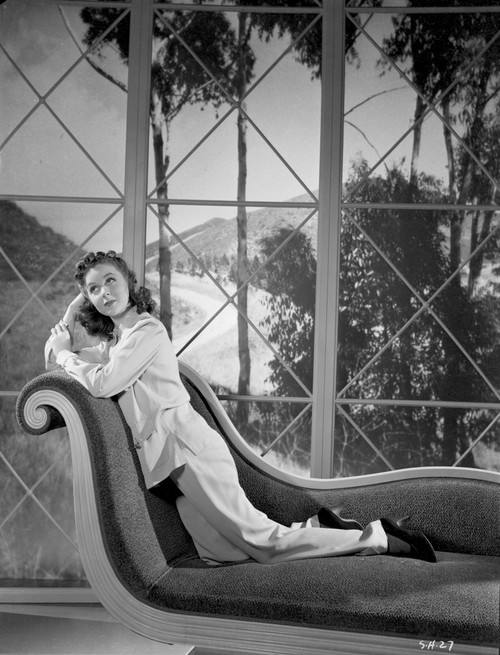 Susan Hayward Leaning on a Chair in White Long Sleeve Blouse Photo Print - Item # VARCEL697768