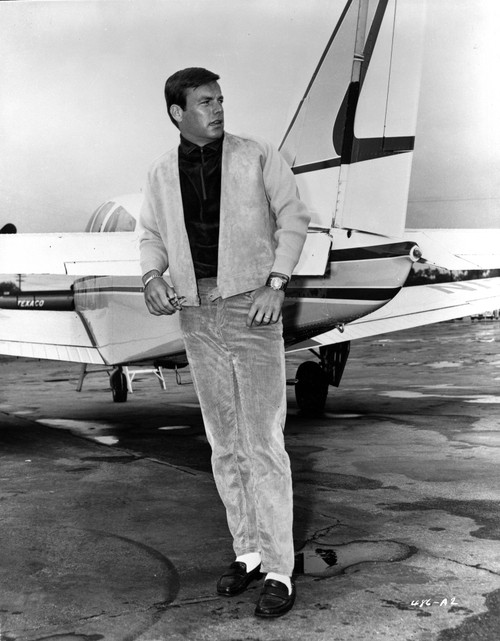 Robert Wagner by an airplane Photo Print - Item # VARCEL697871