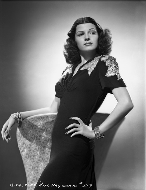 Rita Hayworth in Black Dress Hand on Waist Pose Photo Print - Item # VARCEL697886
