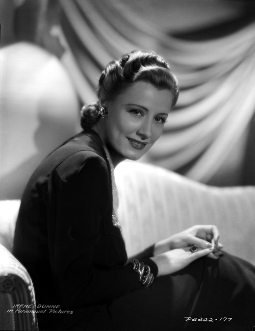 Irene Dunne on a Dress sitting Portrait Photo Print - Item # VARCEL697951