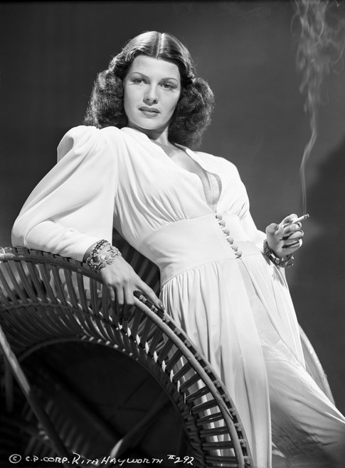 Rita Hayworth Smoking a Cigarette in a White Gown Photo Print - Item # VARCEL698013