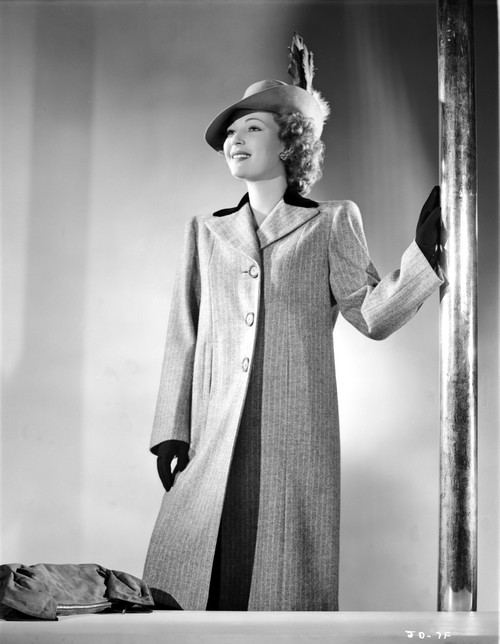 June Duprez on a Dark Coat Holding on a Pole Portrait Photo Print - Item # VARCEL698046
