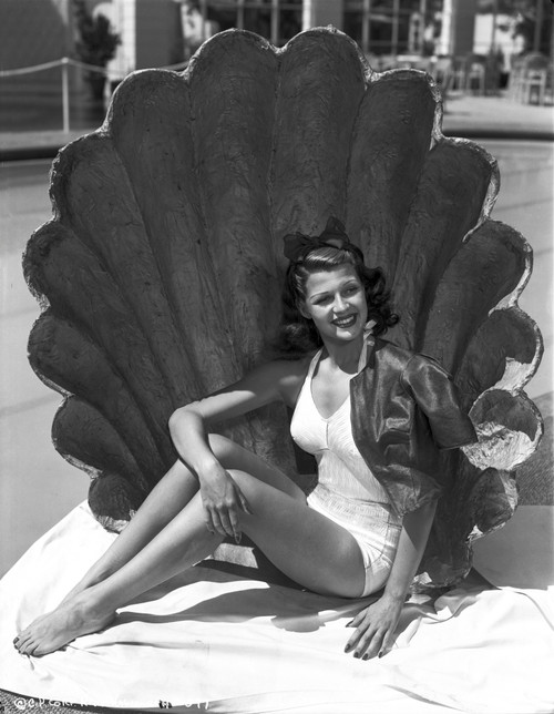 Rita Hayworth Posed with a Big Shell Photo Print - Item # VARCEL698102