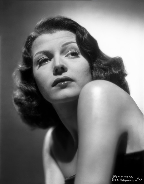 Rita Hayworth Posed in a Black Dress with a Straight Face Photo Print - Item # VARCEL698100