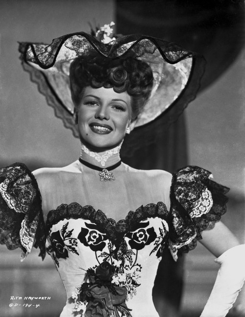 Rita Hayworth Posed with a Colorful Gown Photo Print - Item # VARCEL698129