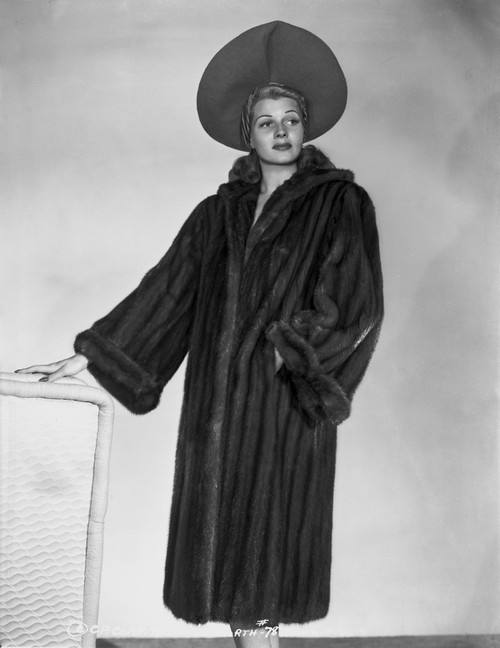 Rita Hayworth Posed with a Black Winter Coat Photo Print - Item # VARCEL698147