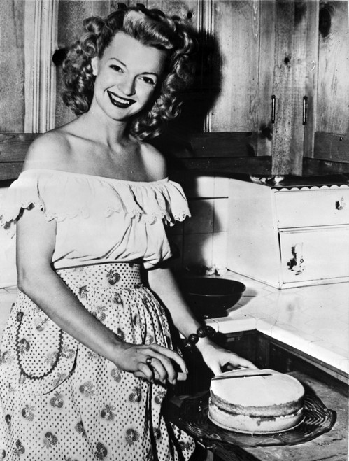 A portrait of Dale Evans with a cake Photo Print - Item # VARCEL698180