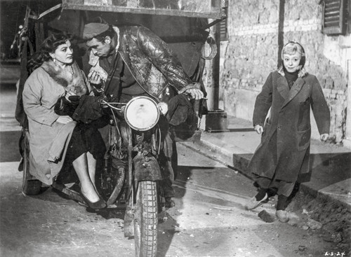 La Strada as Zampano Riding Bike Movie Scene Photo Print - Item # VARCEL698179