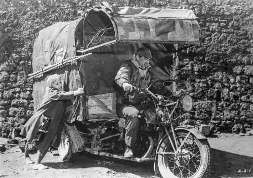 La Strada Man Riding in Motor Cart Photo Print - Item # VARCEL698182