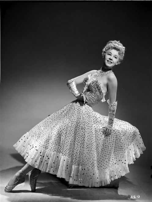 Vera Ellen on Printed Dress sitting and Leaning Portrait Photo Print - Item # VARCEL698211