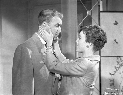 Book Bell Woman Holding His Man's Face Scene Excerpt from Film Photo Print - Item # VARCEL698222