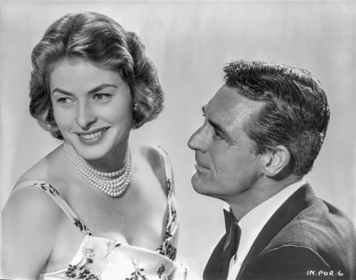 Indiscreet Couple Lady in Printed Dress with Pearl Necklace with a Man in Suit and Tie Photo Print - Item # VARCEL698243