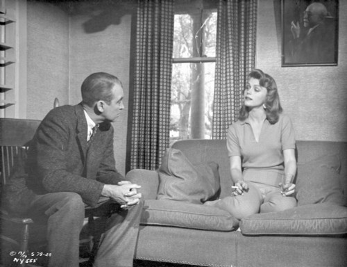 Anatomy Of A Murder Woman Talking to a Guy While sitting on the Sofa in a Movie Scene in Black and White Photo Print - Item # VARCEL698301