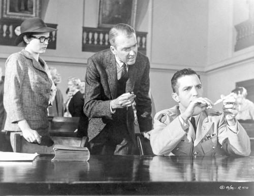 Anatomy Of A Murder Woman Watching the Two Men Testing an Evidence in a Movie Scene in Black and White Photo Print - Item # VARCEL698292