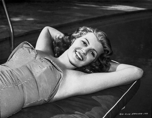 Rita Hayworth Lying Near the Pool Photo Print - Item # VARCEL698300