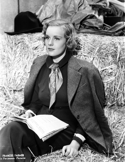 Frances Farmer on Suit and sitting on a Hay Photo Print - Item # VARCEL698339