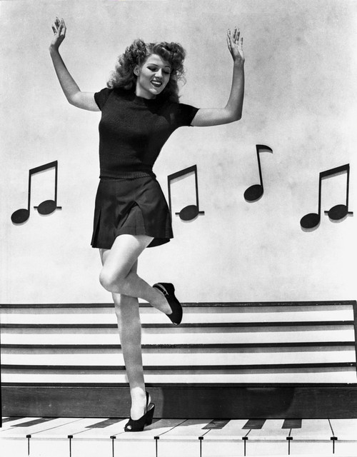Rita Hayworth Music Notes Background in a Dancing Pose Photo Print - Item # VARCEL698323