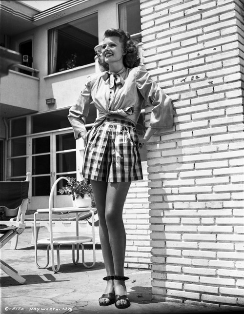 Rita Hayworth wearing a Skirt in a Looking Up Pose Photo Print - Item # VARCEL698359