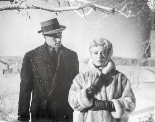 Imitation Of Life Lady in Furry Coat with Man in Black Suit with Hat Photo Print - Item # VARCEL698386