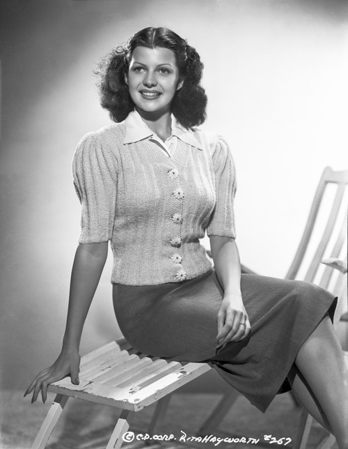 Rita Hayworth posed on the Chair Photo Print - Item # VARCEL698407