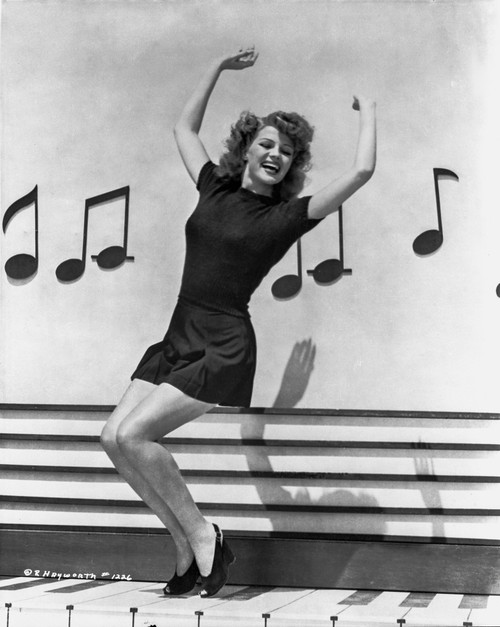 Rita Hayworth Dancing with a Musical Notes Background Photo Print - Item # VARCEL698514