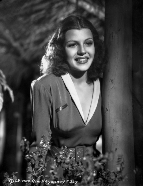 Rita Hayworth smiling Behind a Tree Photo Print - Item # VARCEL698564