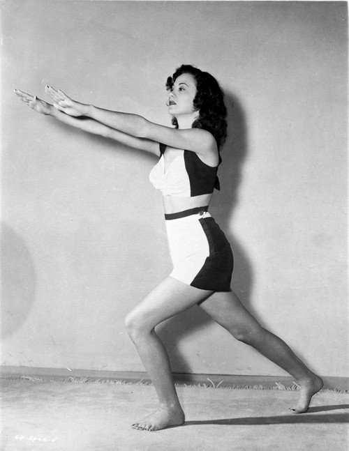 Carol Forman on Midriff with Hands Forward and Bending Leg Photo Print - Item # VARCEL698612