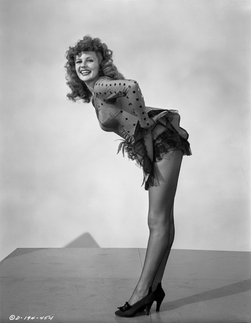 Rita Hayworth Bending Over in Heels Photo Print - Item # VARCEL698593