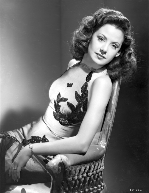 Carol Forman on an Embroidered Halter Dress sitting Photo Print - Item # VARCEL698666