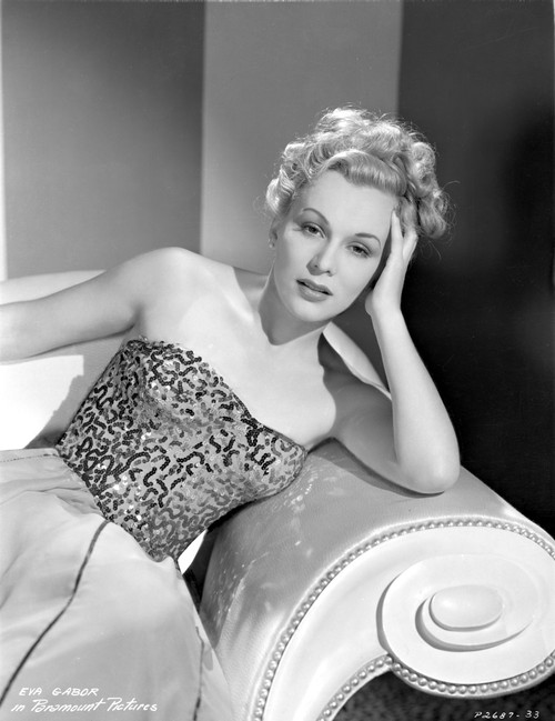 Eva Gabor on a Embroidered Top sitting on a Couch Photo Print - Item # VARCEL698850