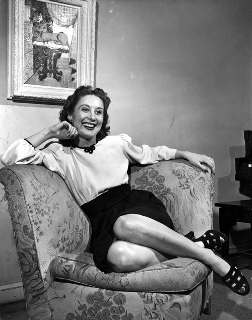 Betty Garrett on a Long Sleeve Top sitting on a Couch Portrait Photo Print - Item # VARCEL698891