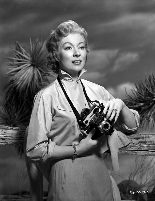 Greer Garson on a Long Sleeve Dress Holding a Camera Photo Print - Item # VARCEL698943