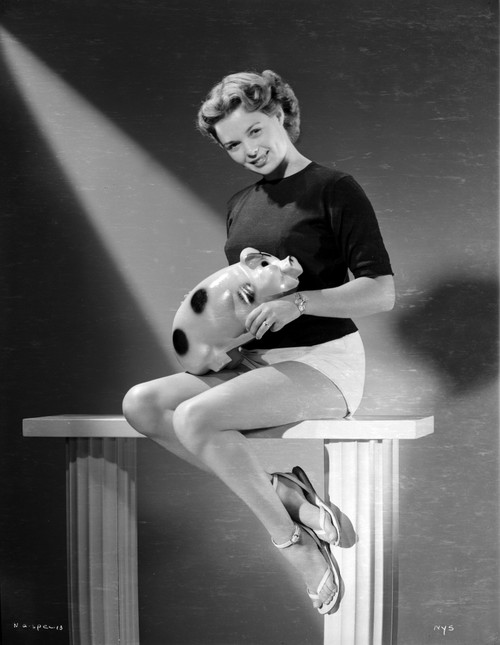 Nancy Gates sitting with a Piggy Bank Portrait Photo Print - Item # VARCEL698968