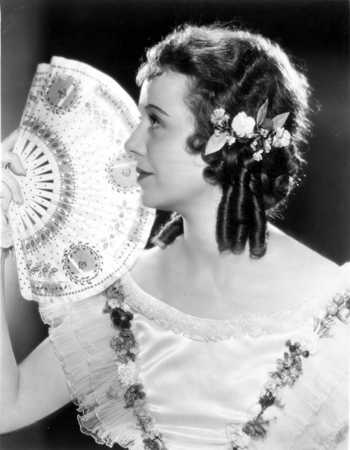 Janet Gaynor on a Dress with Fan and Head on Side view Portrait Photo Print - Item # VARCEL698982