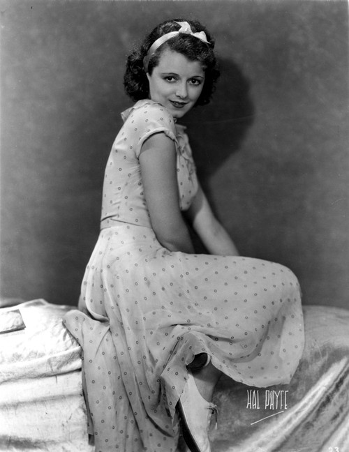 Janet Gaynor on a Dotted Dress sitting Portrait Photo Print - Item # VARCEL699037