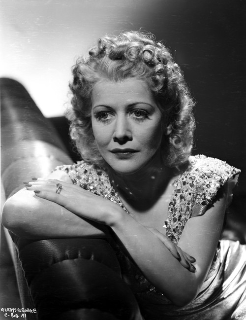 Gladys George on a Beaded Top Leaning and sitting on a Couch Photo Print - Item # VARCEL699080