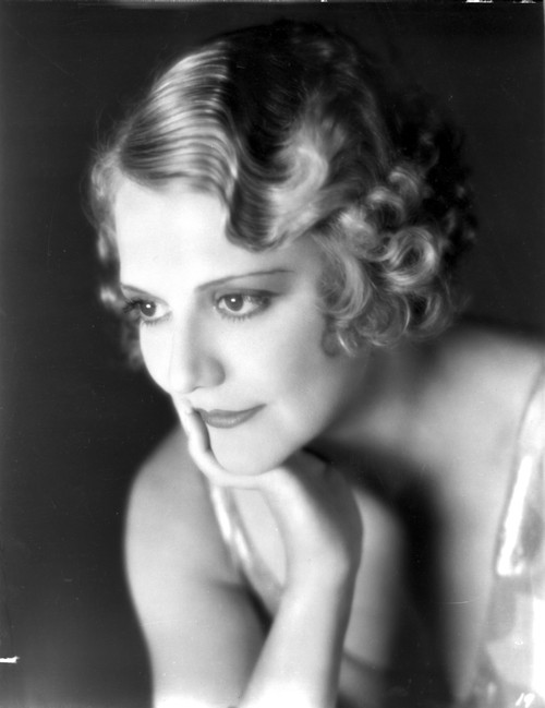 Minna Gombell sitting and Leaning Face on Hand Portrait Photo Print - Item # VARCEL699175