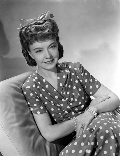 Lillian Gish on a Polka Dotted Dress sitting on a Couch Photo Print - Item # VARCEL699160