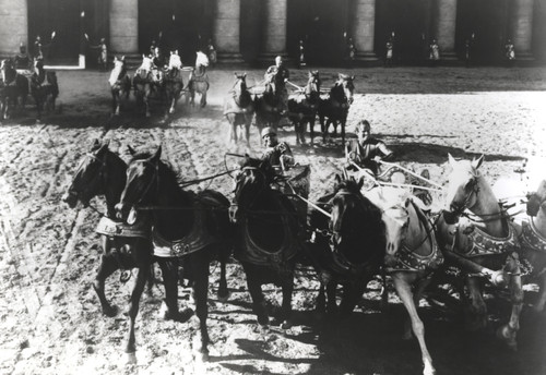 Charlton Heston Riding Horse-Drawn Vehicle in Gladiator Movie Photo Print - Item # VARCEL699285
